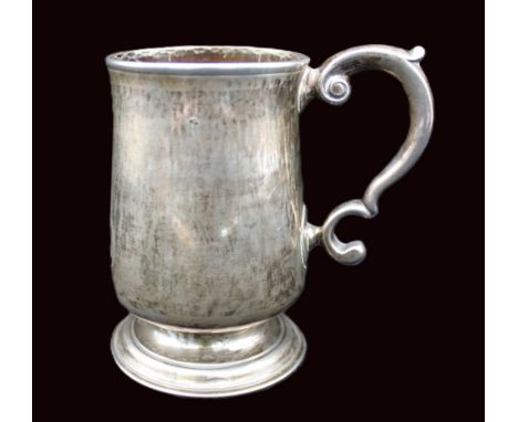 A George III silver tankard, on circular footed base with S scroll handle, side of body with oval cartouche engraved J?R, hal