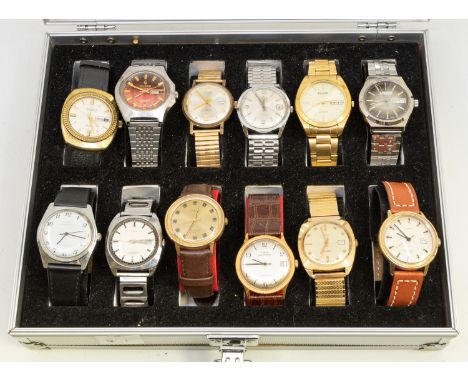 A cased collection of twelve vintage and later gents wristwatches, comprising steel and plated automatic versions, dials in v