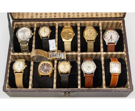 A cased collection of eleven vintage and later gents wristwatches to include steel cased and plated versions, self wind manua