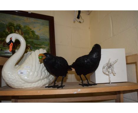 A large swan planter together with a Swarovski ballerina and a pair of model birds