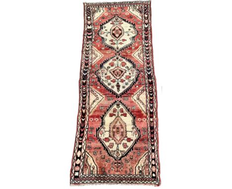 Vintage Persian runner rug, ivory triple medallion on red field with geometric decoration, enclosed by guarded border 277cm x