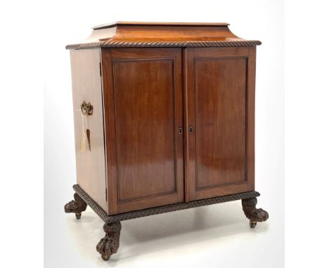 Late 19th century Irish mahogany champagne cellarette, sarcophagus top with gadroon moulded edge lifting to reveal fitted int