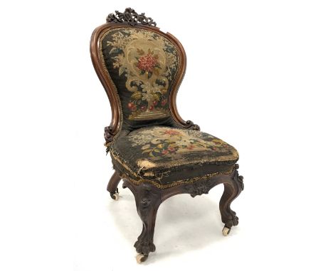 Mid 19th century Irish mahogany hall chair, pierced and carved scrolling acanthus leaf pediment over shaped balloon back, sea