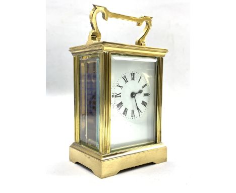 20th century French brass carriage time piece clock, with bevel glazed panels, white enamel dial with Roman chapter ring W8cm
