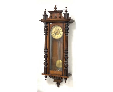 Late 19th century Vienna style wall clock, the walnut case surmounted by turned pilasters, ivorine dial with Roman chapter ri