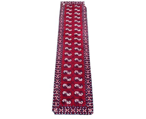 Thick pile hand woven runner, repeating blue and white gul motif on red field, enclosed by border 365cm x 93cm