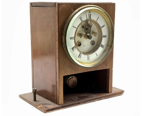 Late 19th century French mantel clock movement, white enamel dial with Roman chapter ring and visible escapement, eight day m