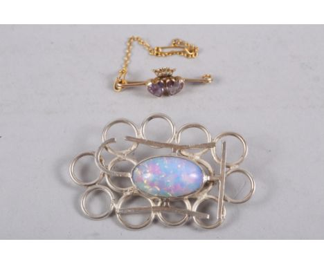 A white metal and opaline mounted brooch, and yellow metal, amethyst and seed pearl brooch 
