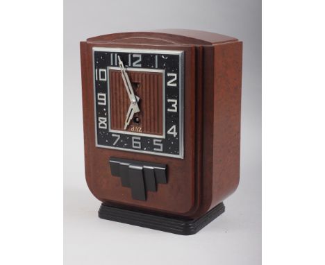 An Art Deco Bakelite clock, by Jaz, 9 1/2" highCondition:Appears to have original movement.A very very small chip to the tria