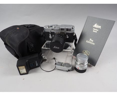 A Leica M3 rangefinder camera, No 1000 2256, with Sumicron 50mm f2 Elmarit M 90mm f2.8 and light meter Leica-Meter MR, togeth