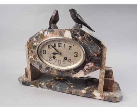 An Art Deco coloured marble mantel clock with pheasant surmount, 11" high 
