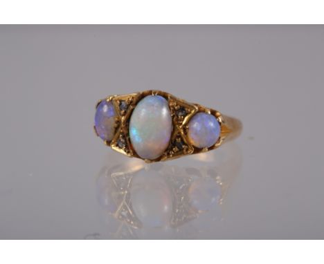 An 18ct gold, opal and diamond dress ring, size O, 4g 