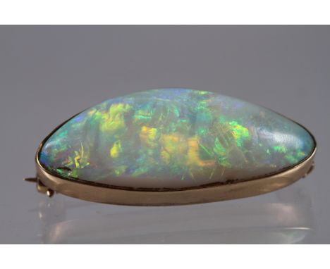 A Victorian yellow metal brooch, stamped 9ct, set vibrant coloured Australian opal, 32mm x 14mm 