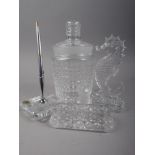A Waterford cut glass biscuit barrel (chip to cover), two Waterford glass model seahorses, larger