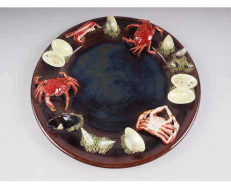 A Palissy style circular serving platter, decorated crustaceans in high relief, 17" dia 