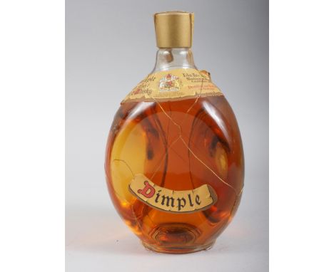 A bottle of Dimple Scotch whisky, circa 1960