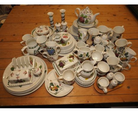 A quantity of mostly Portmeirion "Pomona" pattern tablewares, including mugs, teacups, a teapot (chip to spout), a cheese dis