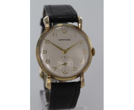 Gents Garrard 9ct Gold cased wristwatch, inscription to back, dial diameter 29mm approx., leather strap (working at time of c