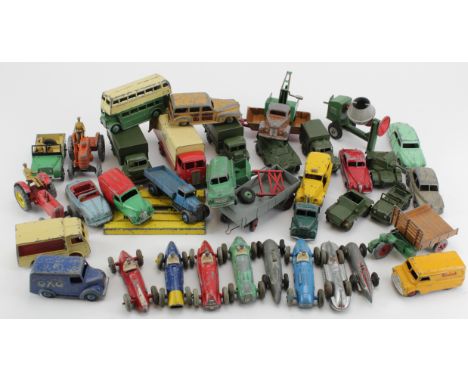 Diecast. A box of Dinky diecast toys, circa mid 20th century, including lorries, tractors, racing cars etc.