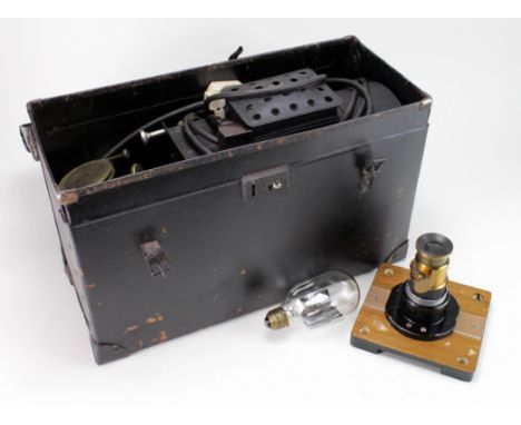 Magic Lantern projector with brass lens, contained in a case, together with an extra bulb, lantern length 31cm approx.