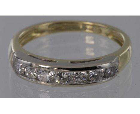 18ct channel set diamond seven stone ring, approx. 0.50ct, size K, weight 2.8g