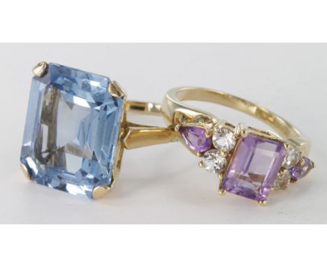 9ct blue stone solitaire dress ring, size R, weight 5.5g. 9ct amethyst and cz seven stone dress ring, size N, weight 3.7g