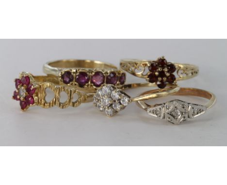 Five 9ct ruby, garnet, diamond and paste set rings, weight 9.0g