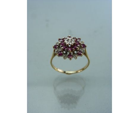 9ct Gold Ruby and Diamond ‘Target’ Dress Ring. Central small Diamond set in a white gold illusion setting, surrounded by 8 sm