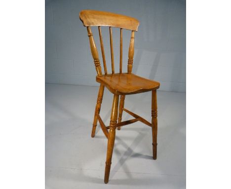 Childs punishment type chair with high stick back and long legs. 