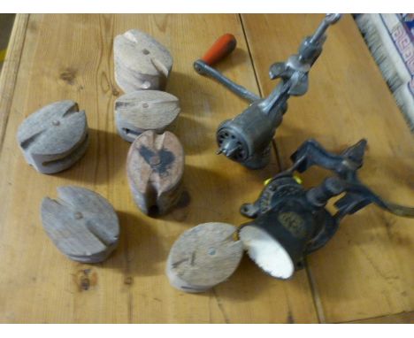 Antique coffee grinder, mincer and a selection of vintage pulleys