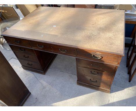 A MAHOGANY TWIN PEDESTAL PARTNER'S DESK WITH  LEATHER TOP AND NINE DRAWERS 