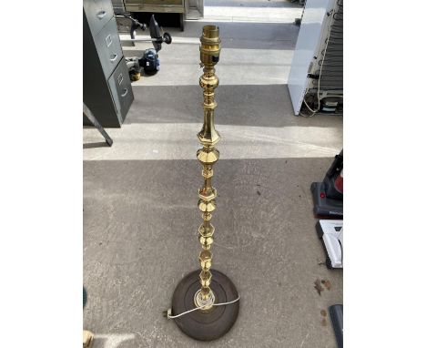 A BRASS STANDARD LAMP WITH WOODEN BASE 