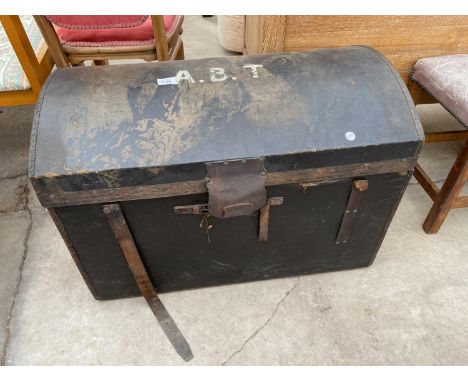 A VICTORIAN DOMED TOP TRAVEL TRUNK 