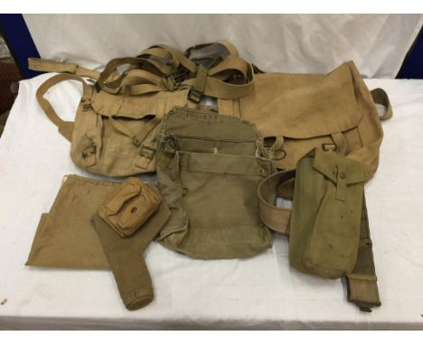 A COLLECTION OF WWII MILITARY CANVAS EQUIPMENT TO INCLUDE AMMUNITION POUCH, PISTOL HOLSTER, MAP CASSE, TWO CANVAS BAGS ETC 