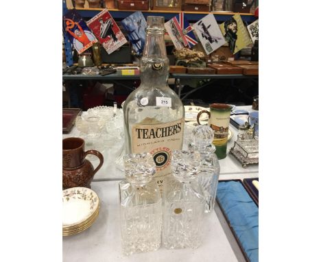 A LARGE TEACHERS SCOTCH WHISKY BOTTLE AND THREE DECANTERS 
