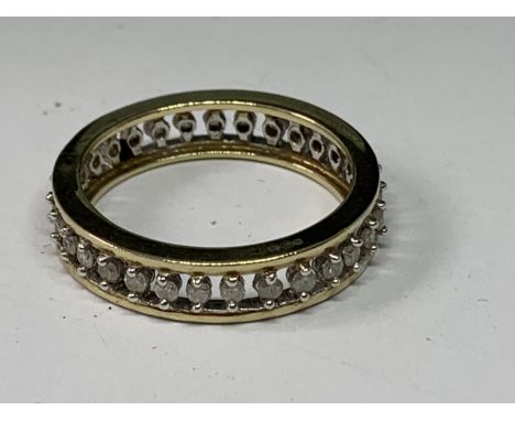 A 9 CARAT GOLD ETERNITY RING WITH DIAMONDS SIZE N IN A PRESENTATION BOX 