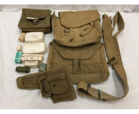 A WORLD WAR II AIRCRAFT FIRST AID OUTFIT AND CONTENTS TO INCLUDE DRESSINGS ETC, CANVAS PISTOL HOLSTER, TWO CANVAS BAGS ETC 