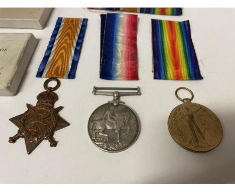 A SET OF THREE WORLD WAR I MEDALS AWARDED TO AND ENGRAVED SERGEANT H WHITEHURST A.S.C. WITH ORIGINAL POSTAGE BOX, RIBBONS AND