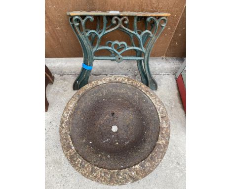 A PAIR OF VINTAGE CAST BENCH LEGS AND A CAST IRON WATER FEATURE BOWL/PLANTER 
