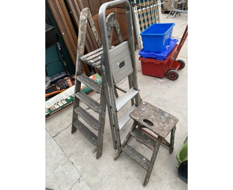 A VINTAGE WOODEN FOUR RUNG STEP LADDER,A THREE RUNG ALUMINIUM STEP LADDER AND A SMALL WOODEN STEP 