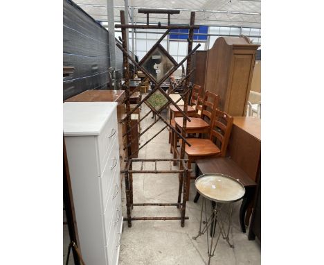 A VICTORIAN BAMBOO HALL STAND WITH MIRRORED AND TILE BACK AND FOUR STICK DIVISIONS, 25" WIDE 
