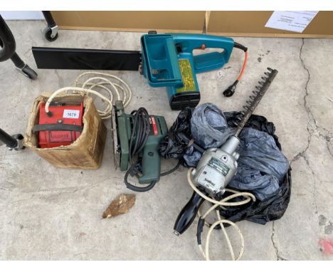 AN ASSORTMENT OF TOOLS TO INCLUDE A BOSCH SANDER, AN ELECTRIC CHAINSAW AND A HEDGE TRIMMER ETC 