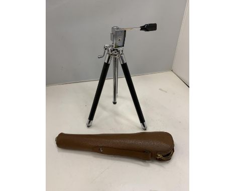 A CAMERA TRIPOD AND A LEATHER CASE 