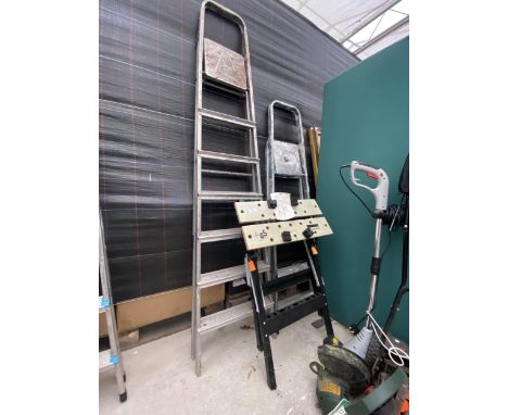 A SIX RUNG ALUMINIUM STEP LADDER, A FOUR RUNG STEP LADDER AND A FOLDING WORK BENCH 