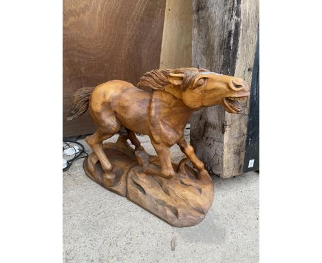 A VINTAGE WOODEN CARVED HORSE FIGURE 