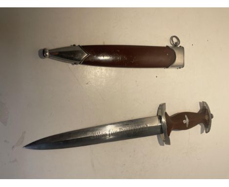 A WORLD WAR 2 GERMAN S.A. DAGGER WITH SCABBARD. BEARING STAMP TO THE BLADE RZ M 7/66 1940 AND INSCRIPTION ALLES FUR DEUTSCHLA