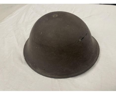 A BRITISH WORLD WAR 2 "TURTLE" MARK 4 HELMET  - FIRST ISSUED FOR THE NORMANDY LANDINGS - IT HAS BEEN OWNED BY THE VENDOR FOR 