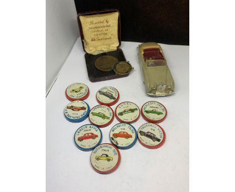 VARIOUS VINTAGE ITEMS TO INCLUDE TEN ITALIAN LICORICE COLLECTABLE CARS TINS, A DINKY/MECCANO BENTLEY AND TWO MEDALS 