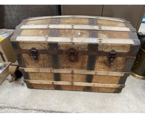 A VINTAGE WOODEN AND METAL BANDED STORAGE TRUNK 
