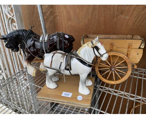 TWO CERAMIC HEAVY HORSE FIGURES AND A WOODEN CART 